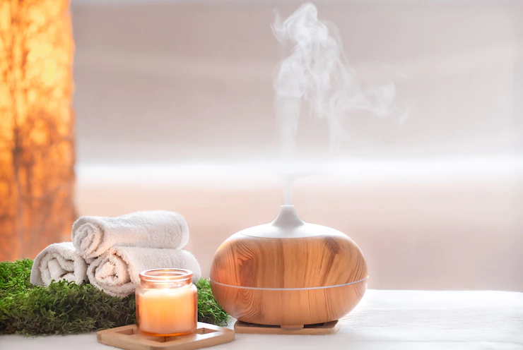 spa-composition-with-aroma-modern-oil-diffuser-with-body-care-products_169016-6709