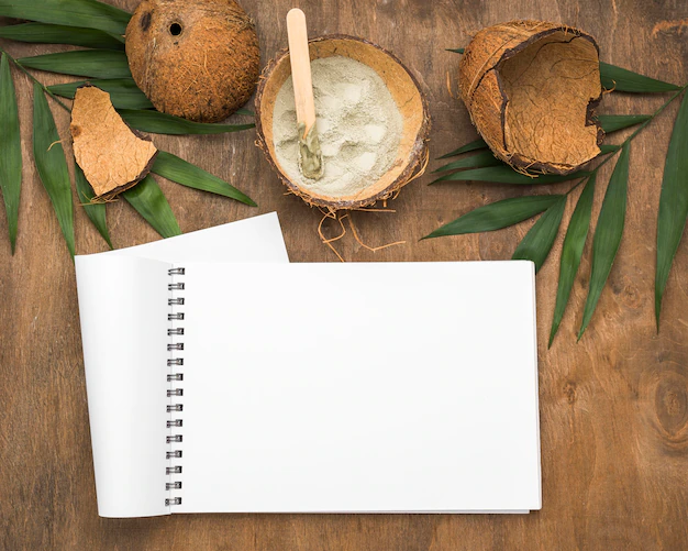 notebook-with-powder-coconut-shell-leaves_23-2148774918