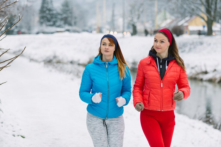 female-athlete-jogging-together-winter_23-2147905419